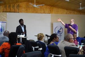Photo 9: Thomas Schirrmacher speaking to the debate, sitting right of him Bishop James Allen Yaw Odico Â© BQ/Martin Warnecke