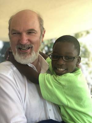 Photo: Thomas Schirrmacher with one of the children of the projects of Giving Hands in Haiti Â© Schirrmacher