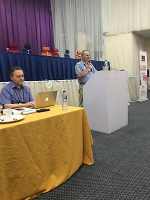 Photo: Dr. Fernando Da Silva during his speech, on the left Linus Pfister, Hilfsaktion Märtyrerkirche and RLP board member © Dr. Werner Nel